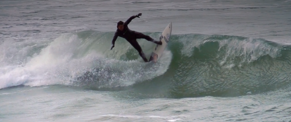 Video still of someone surfing but no pause button